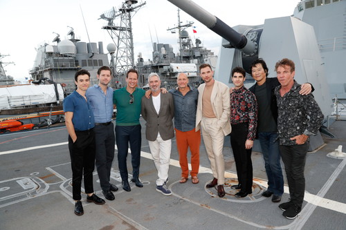HONOLULU, HAWAII - OCTOBER 20: (L-R) The Midway cast Keean Johnson, Luke Kleintank, Patrick Wilson, director Roland Emmerich, Woody Harrelson, Ed Skrein, Darren Criss, Etsushi Toyokawa, and Dennis Quaid stand aboard the USS Halsey on October 20, 2019 in Honolulu, Hawaii. (Photo by Marco Garcia/Getty Images for Lionsgate Entertainment)