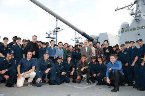HONOLULU, HAWAII - OCTOBER 20: Cast and crew from the film Midway stand with a group of sailors aboard the USS Halsey on October 20, 2019 in Honolulu, Hawaii. (Photo by Marco Garcia/Getty Images for Lionsgate Entertainment)