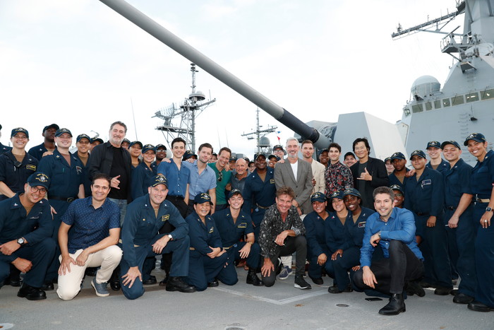 HONOLULU, HAWAII - OCTOBER 20: Cast and crew from the film Midway stand with a group of sailors aboard the USS Halsey on October 20, 2019 in Honolulu, Hawaii. (Photo by Marco Garcia/Getty Images for Lionsgate Entertainment)